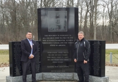 Ontario Regional Chief Isadore Day with Bkejwanong/Walpole Island Chief Dan Miskokomon at the Indian Residential School Memorial in the First Nation.